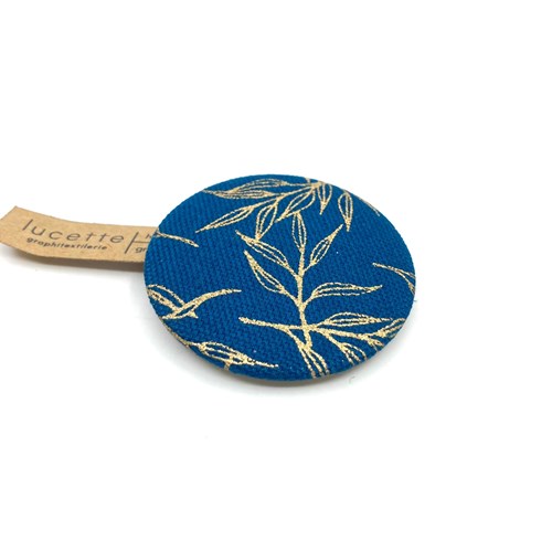 Broche ronde feuilles dorées sur bleu